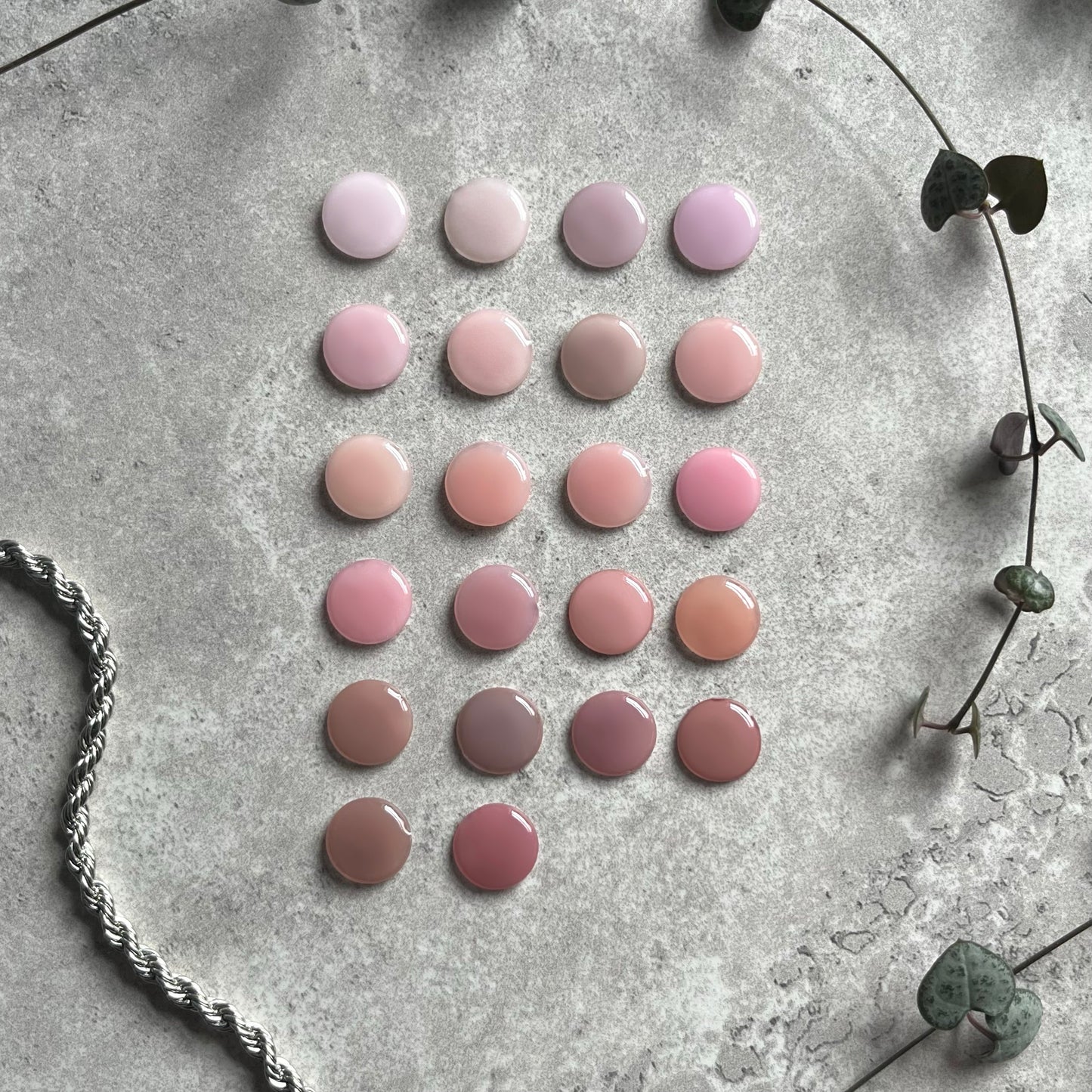 a bunch of different colored buttons sitting on top of a table